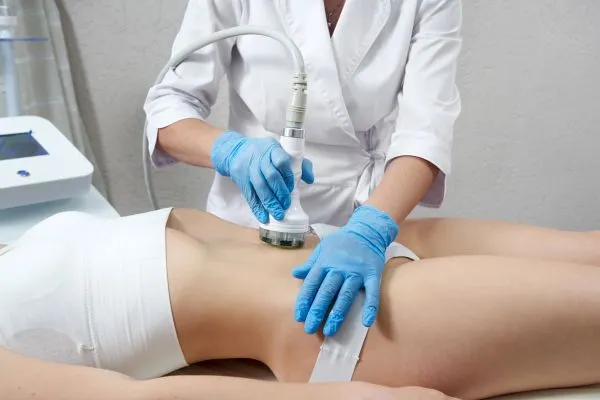 Lost the Weight but Not the Loose Skin? 2 woman having HIFU treatment on her stomach to combat loose skin Boston following weight loss
